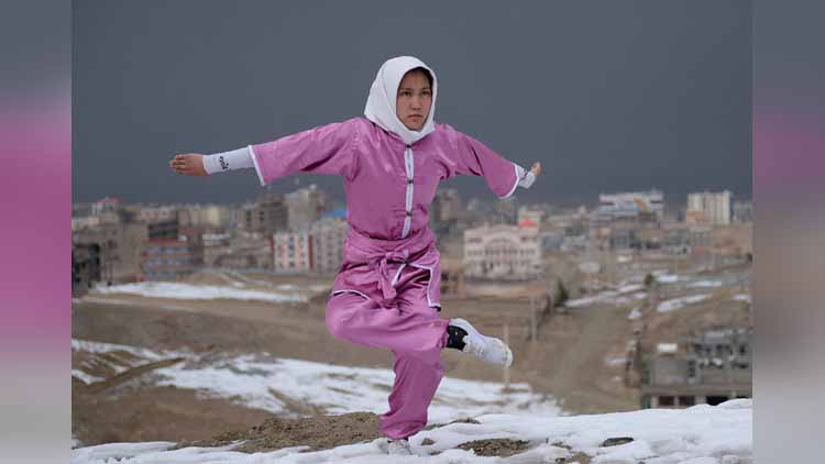 A girl with one of the wushu pose.