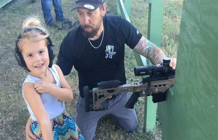 4 year old girl practices by Rifle 