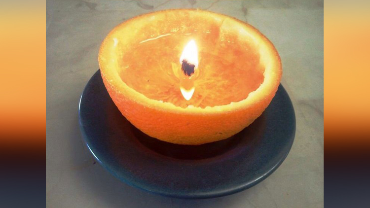  Fill an orange peel with with cooking or lamp oil, and light it