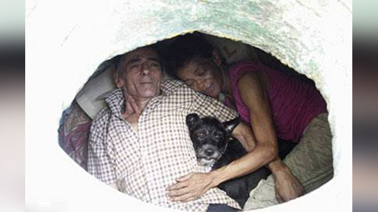 Homeless couple calls Colombian sewer home