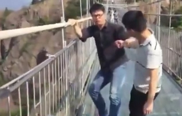 video show tourists dragged across glass bridge