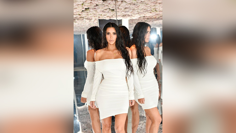 Kim Kardashian flaunts her epic figure in white dress