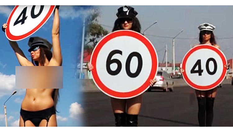 russia road safety campaign sees topless women carrying speed limit