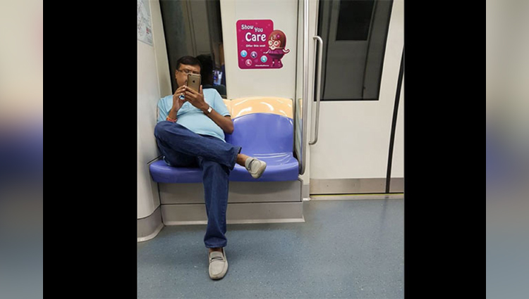 man making video of girl in metro