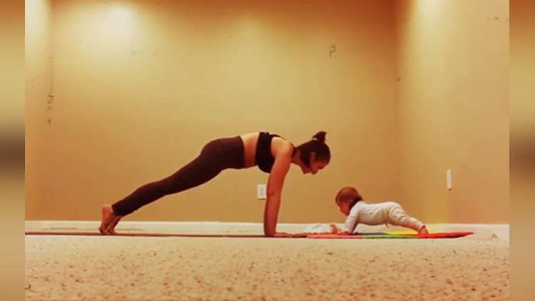 Six month old does 34 second plank for yoga loving mom