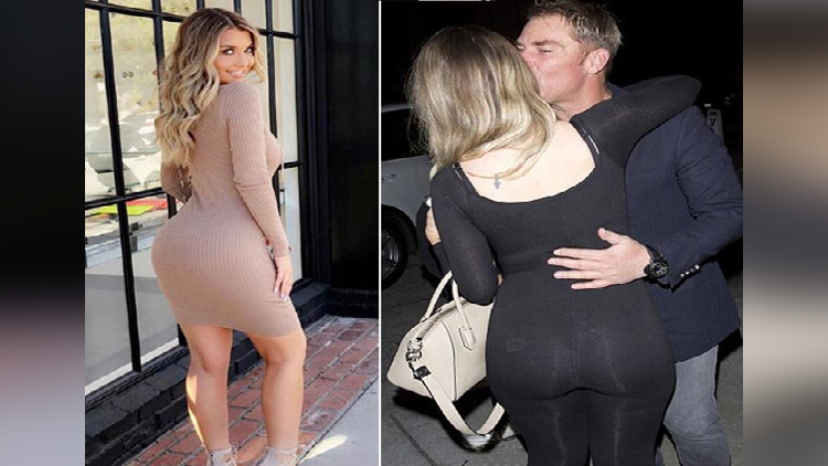 Shane Warne is spotted kissing a Blonde Model emily sears