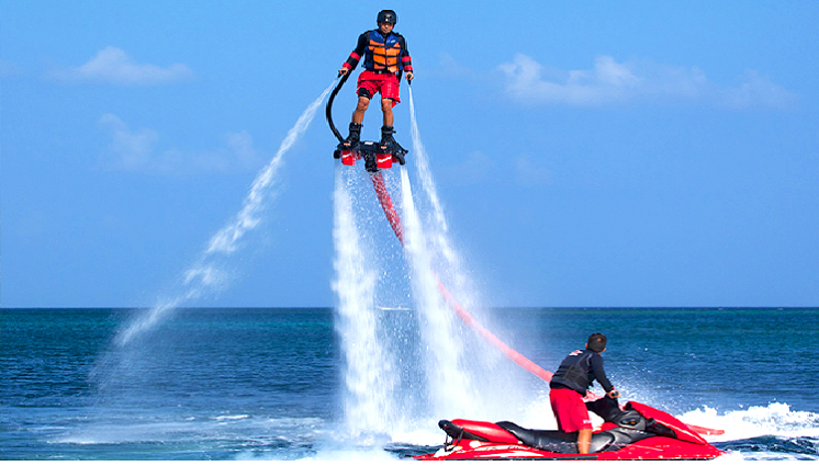 People surfing on Flyboard