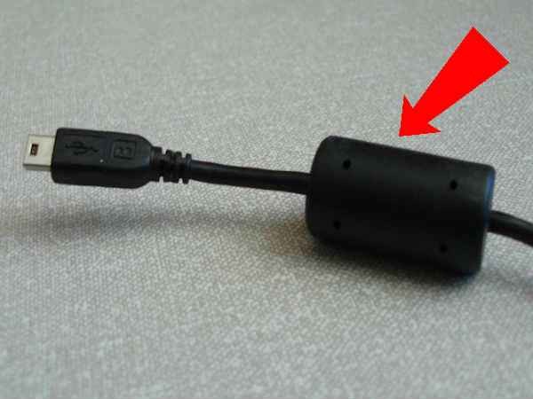Why there is a black cylinder in the laptop charger