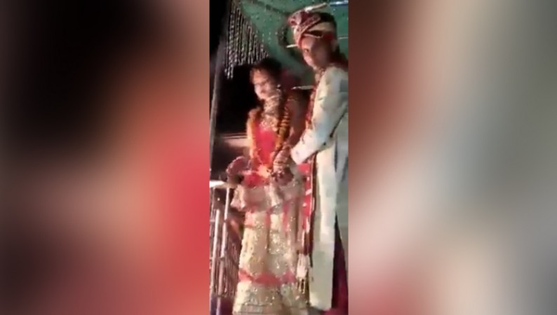 The groom started lifting the bride on the stage, then people were shocked to see what happened