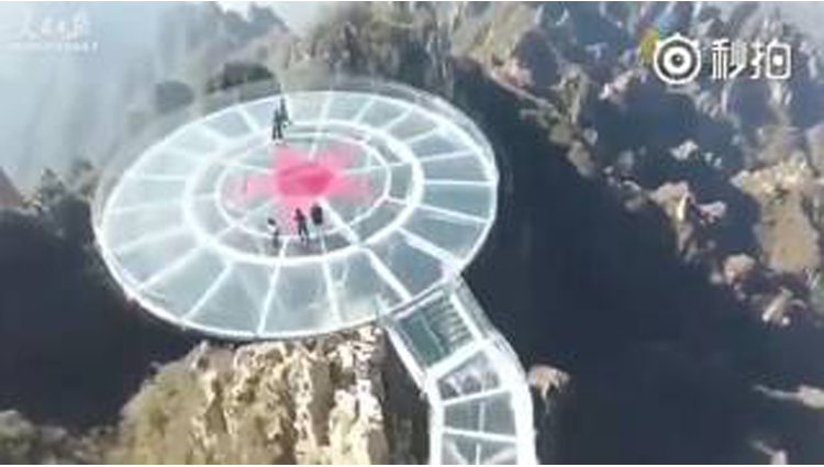 Thrill seekers rejoice: aerial view of a sky-high glass bridge atop the Mount Langya in N. China