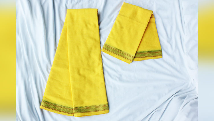 why we wear yellow clothes on pooja