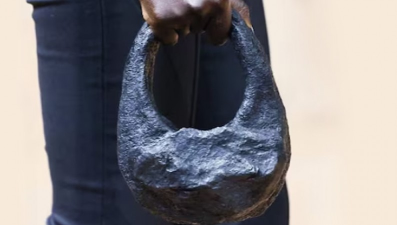 This purse is made of meteorite stone, the weight is so much that it is expensive to lift