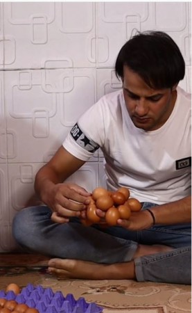 Man creates world record for most eggs balanced on back of hand video viral on social media