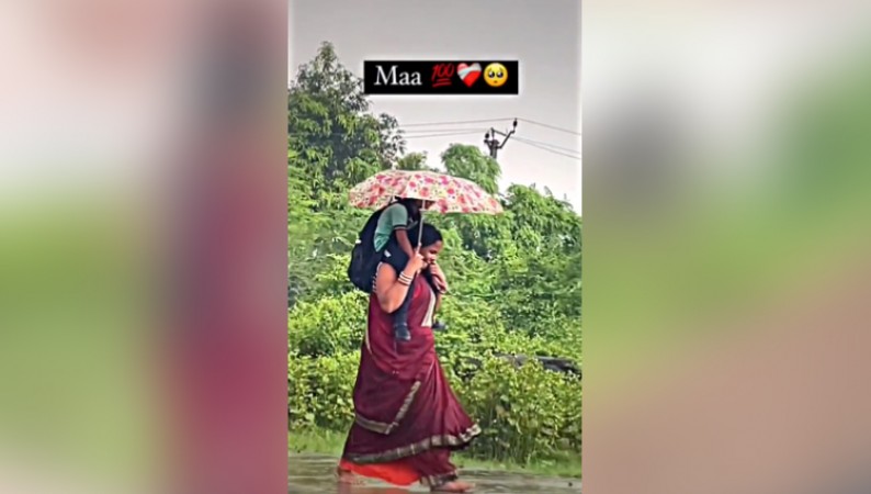Watch Woman Carries Daughter In Pouring Rain