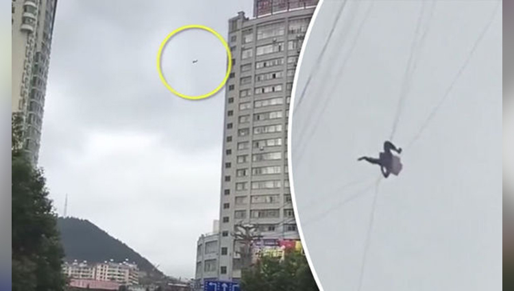 Man stuck mid-air after trying to skip hotel bill using telecom wires between two buildings
