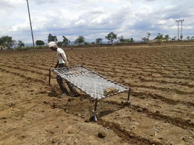 farmer cultivate his farm by hit cot