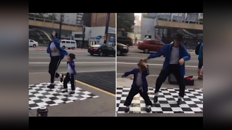mini Michael kid wows passers-by as he pulls off Jackson-style dance moves in the street